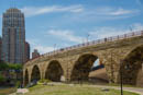 That same Stone Arch Bridge with a tired Damian sitting under it.